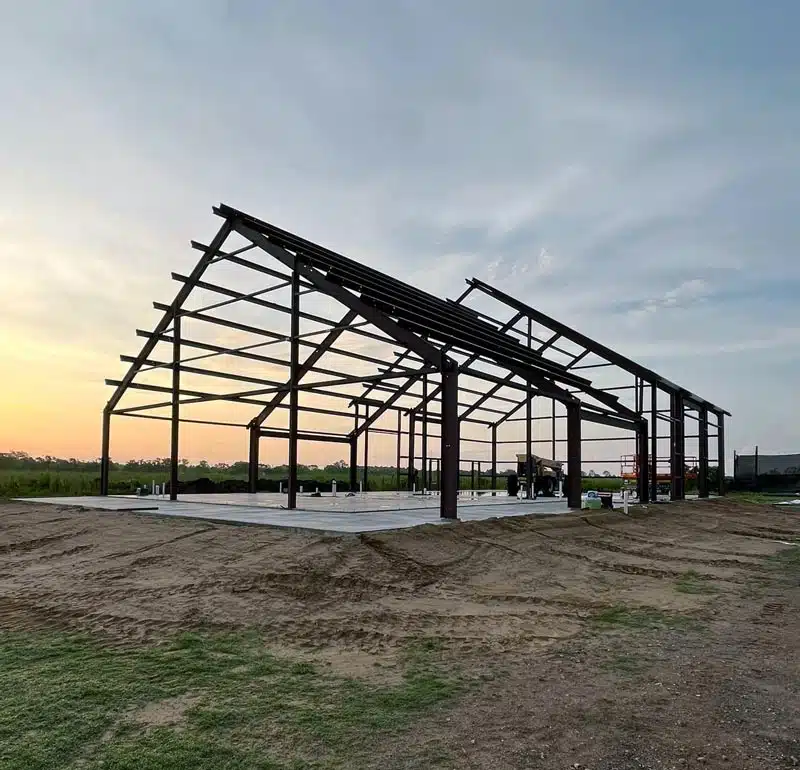 Barndominium frame at sunset in Indiana